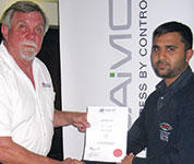 Sharlin Govender (right) being presented with his membership certificate.